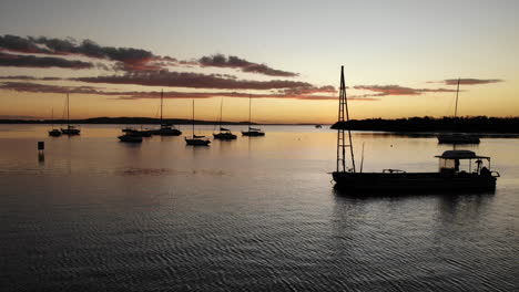 aerial marina bay port sunset sailing boat drone 4k