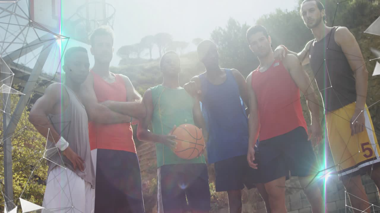 Camera tilting up after player bringing basketball forward, six men lining up for sports portrait