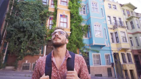 young man walking in touristic place.