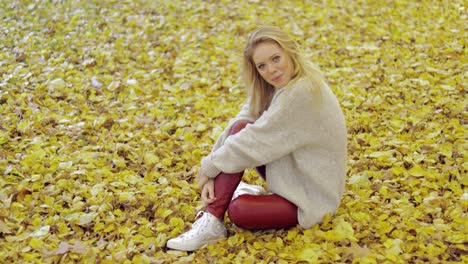 Pretty-woman-sitting-on-ground