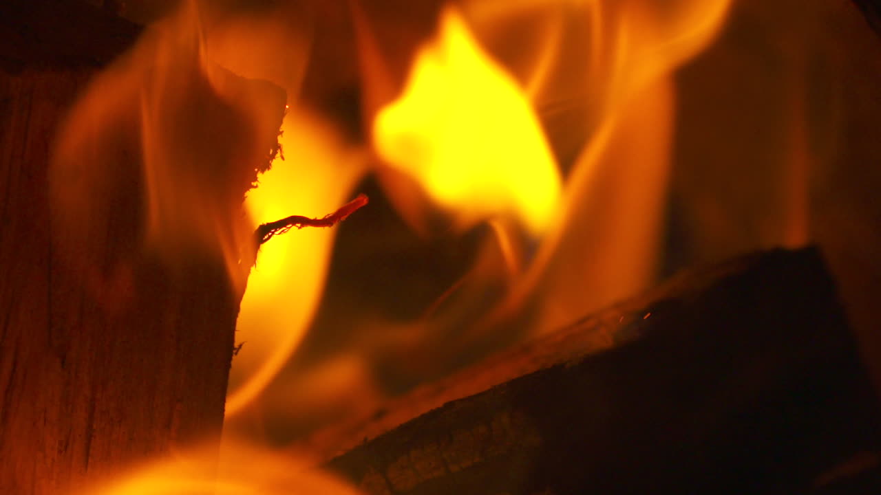 Premium stock video - Macro close up, flames flickering in a scorching ...