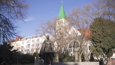 statues and church at the slovakian uprising memorial in bratislava