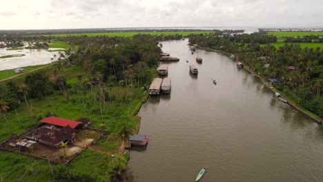 aerial view of several houseboats sailing backwaters of kerala, india