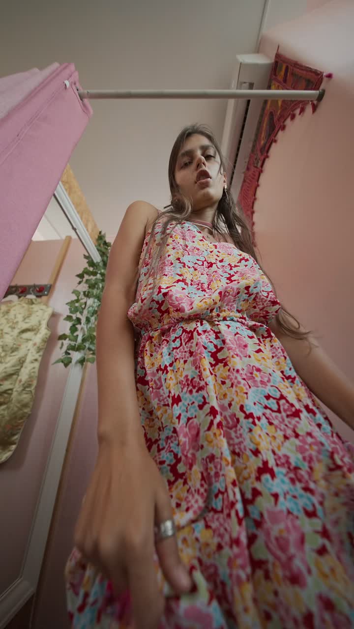 Photos of woman in floral dress inside changing room