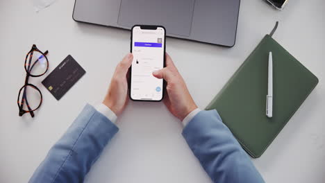 person using a phone for online shopping on a table