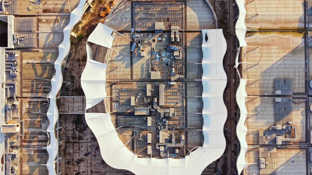 Modern building design in an urban area showing shapes and structures from an aerial view during daylight