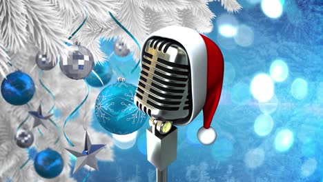 Animation-of-retro-microphone-with-santa-hat-over-christmas-tree-with-baubles-on-blue-background