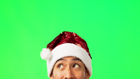 Man,-face-and-Christmas-hat-by-green-screen