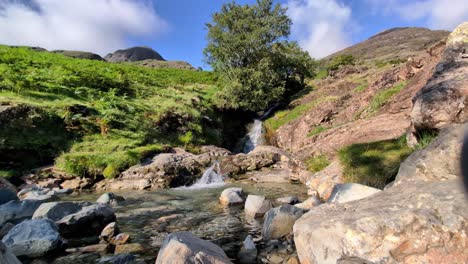 footage of Scale Force, the tallest waterfall in the Lake District, on a beautiful sunny day