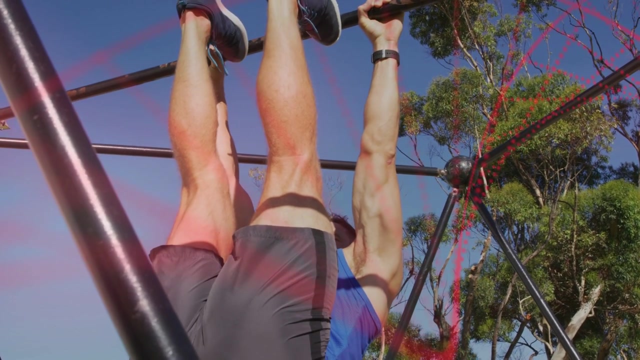 Man gripping bar and doing hanging leg raises for core fitness, red-pink overlay passing
