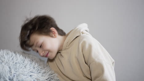 child sleeping on a sofa