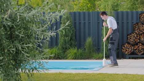 pool cleaner working at the poolside