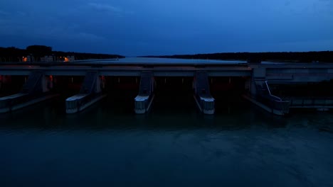 Hydroelectric-Dam-In-Danube-River-At-Night---aerial-drone-shot