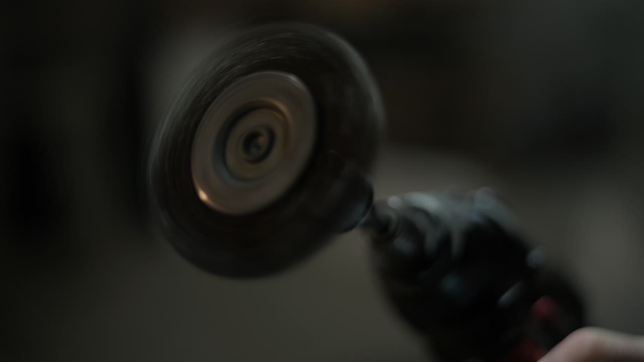 Close-up of a Spinning Wire Brush Attachment on a Rotary Tool