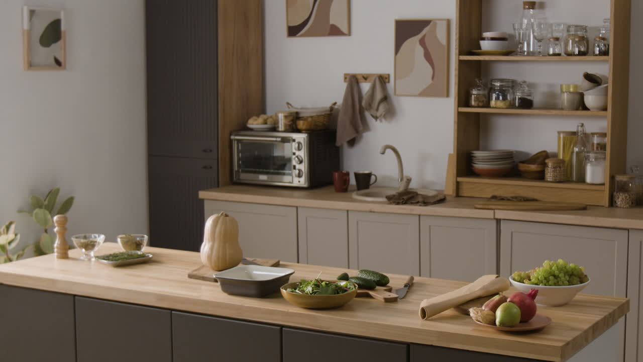 A kitchen scene with vegetables and fruits on the countertop