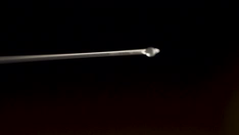 syringe needle with liquid drop