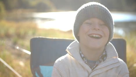 Close-up-handheld-shot-of-family-laughing-outside-tent