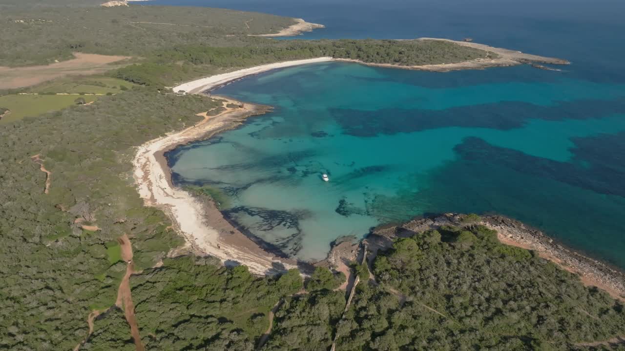 Beautiful unspoiled beach Son Saura Menorca island Spain white sand shallow Mediterranean sea water