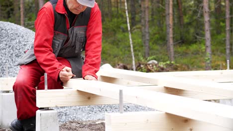 building carpenter marking measurements. slow motion