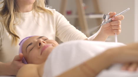 facial treatment with airbrush