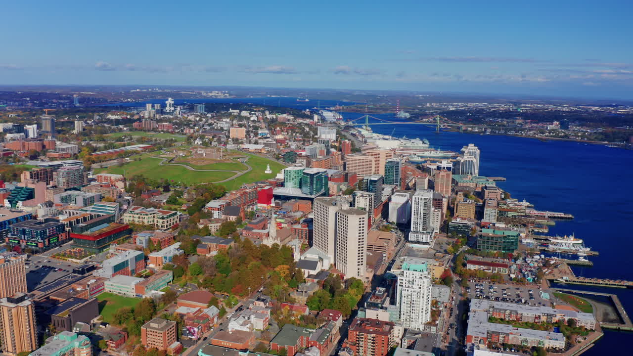 Aerial drone shot over Halifax downtown, Nova Scotia, Canada.
High view of the cityscape, ocean and the urban buildings.