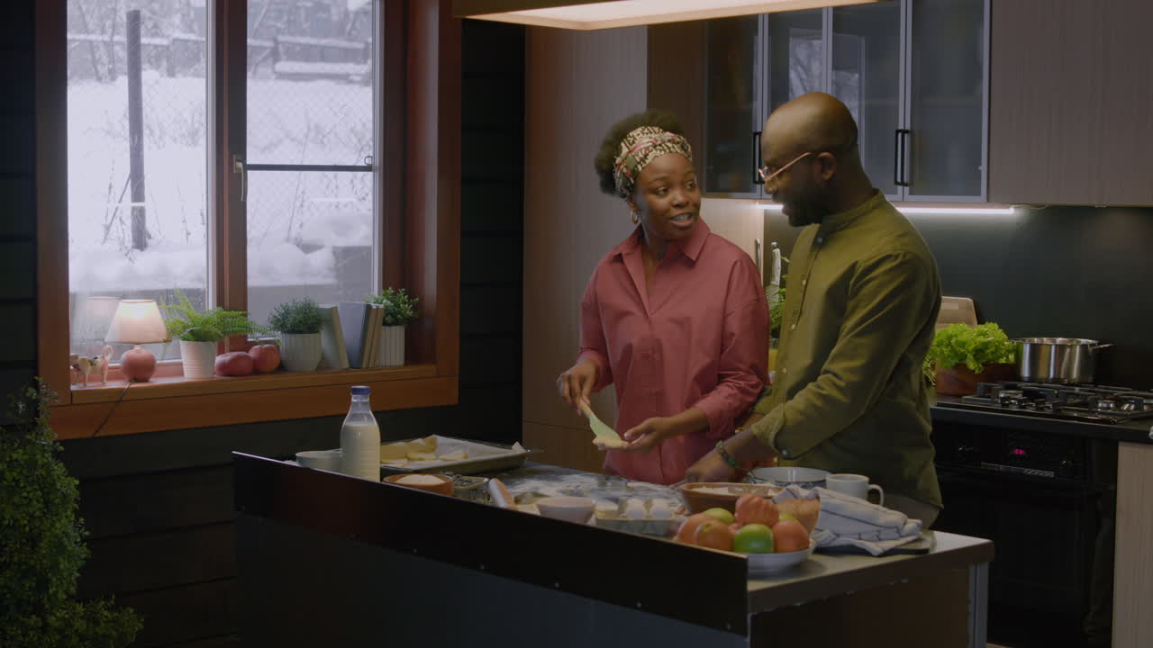 Couple making cookies