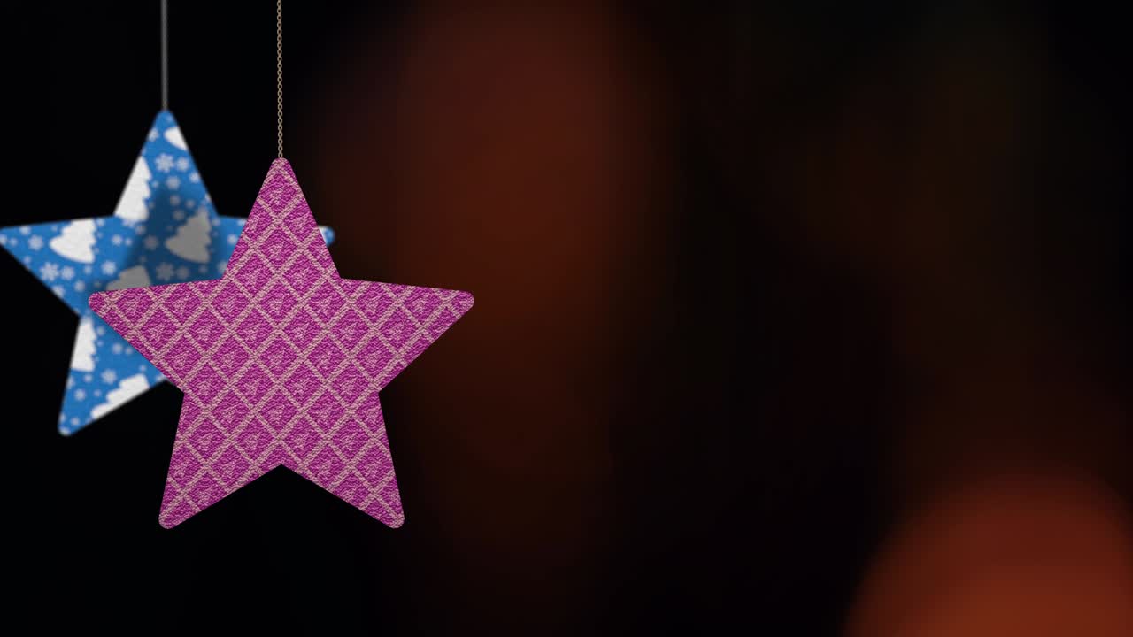 los adornos de las estrellas de navidad se mueven en el fondo de bokeh.