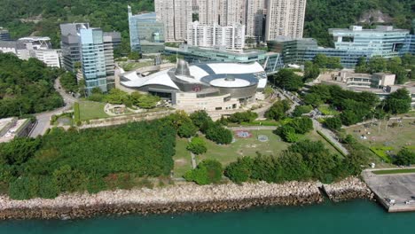 Hong-Kong-Cyberport-waterfront-park-luxury-residential-buildings,-Aerial-view