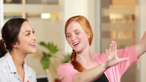 casual business team brainstorming in front of colleague