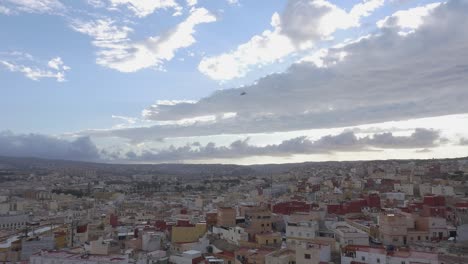 Panoramic view of Melilla, showing its rooftops, buildings and the city along the valley, with a spectacular view of the cloudy sky
