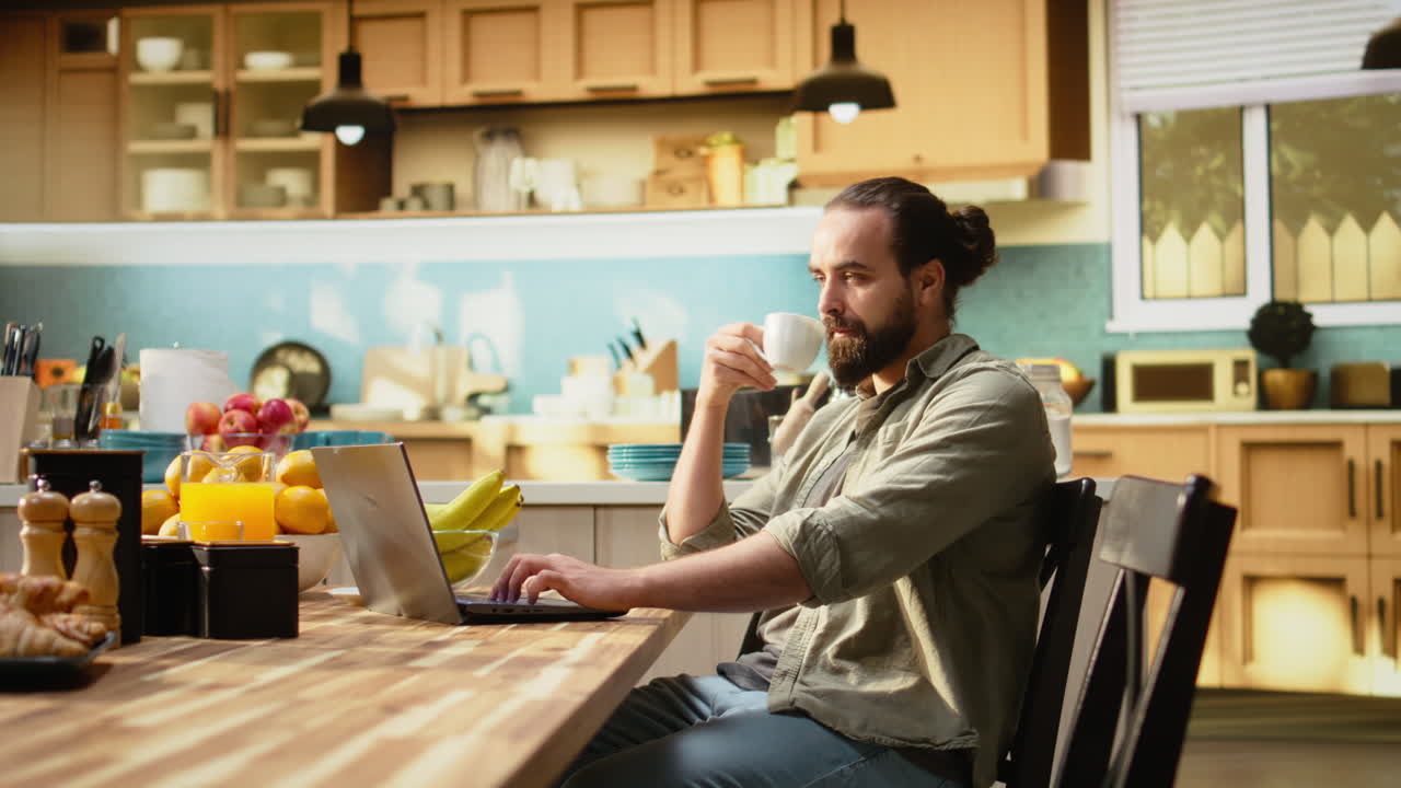 Remote worker, kitchen table with laptop, online work and tasks