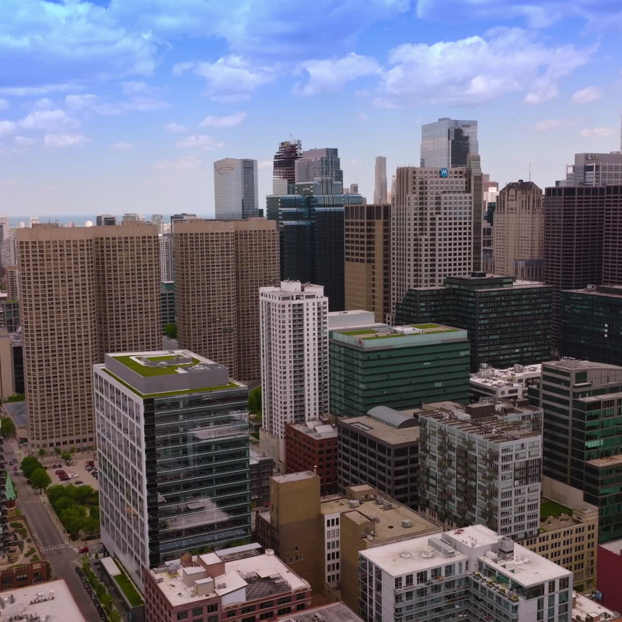 Chicago panoramic view on sunny midday. Impressive buildings towering over complicated road systems. Aerial perspective
