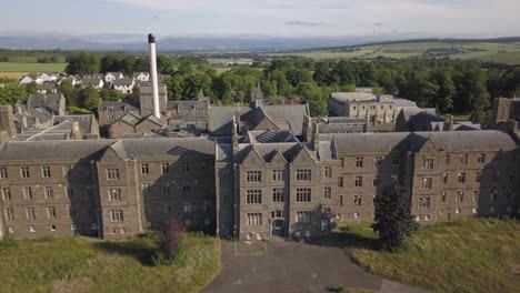 Aerial-view-of-Sunnyside-abandoned-hospital,-Montrose,-Angus,-Scotland