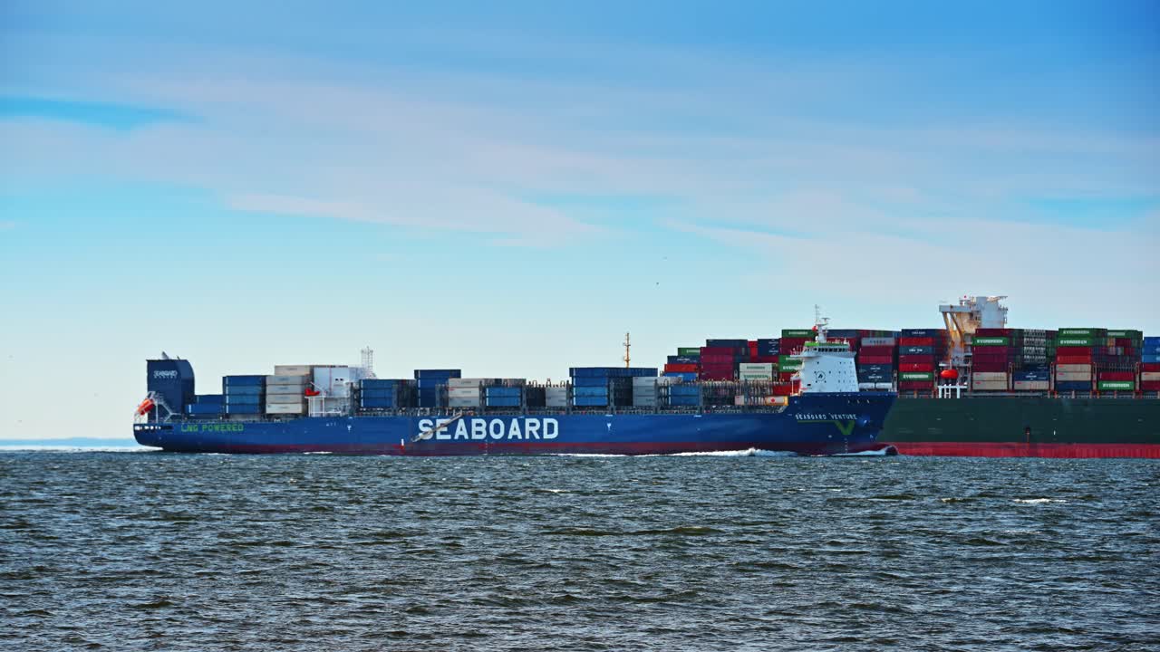 New York, USA, 24 December 2025: Seaboard container ship crossing harbor. Seaboard container vessel travels across New York Harbor shipping lane