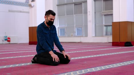 masked man turning his head mosque 1