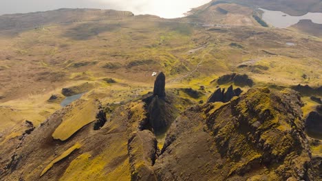 aerial drone footage of the dramatic mountain landscapes on the isle of skye, scotland. sweeping panoramic views of majestic peaks, green valleys, and wild nature. old man of storr