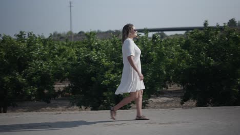 woman walking in an orchard