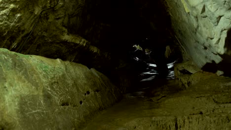 a woman climbs in karst caves