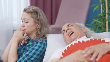 thoughtful woman at the bedside of her sick husband. sad.