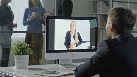 businessman and businesswoman on a video call talking about a project