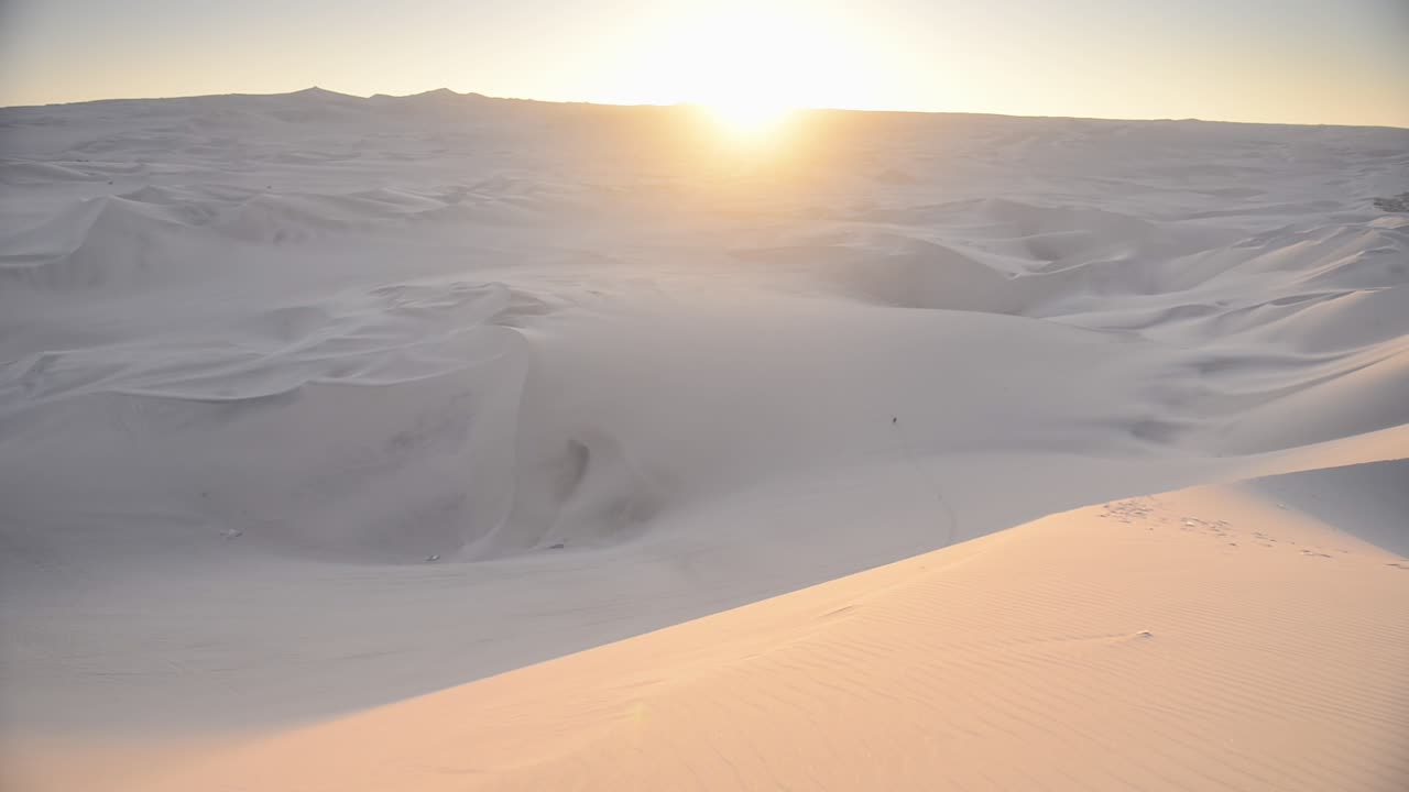 Panoramic landscape view of desert dunes, at sunset, Peru