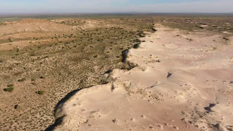 aerial view of a massive white sand dune in the arid region of the northern cape, south africa