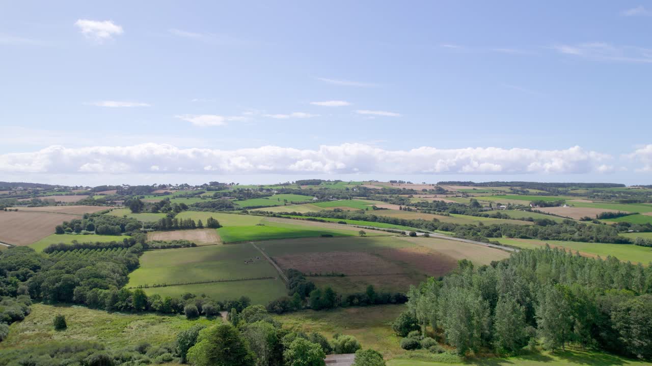 Clouds shadows over Brittany rural landscape and cultivated wheat fields in France