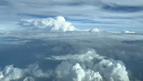 pilot point of view durting cruise level while flying between stormy clouds