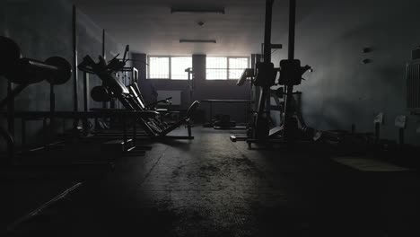 gym equipment discarded in an abandoned empty room