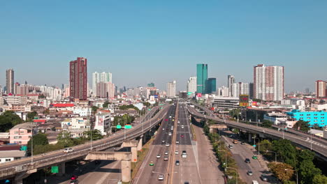 drones fly over the buildings and business districts in bangkok