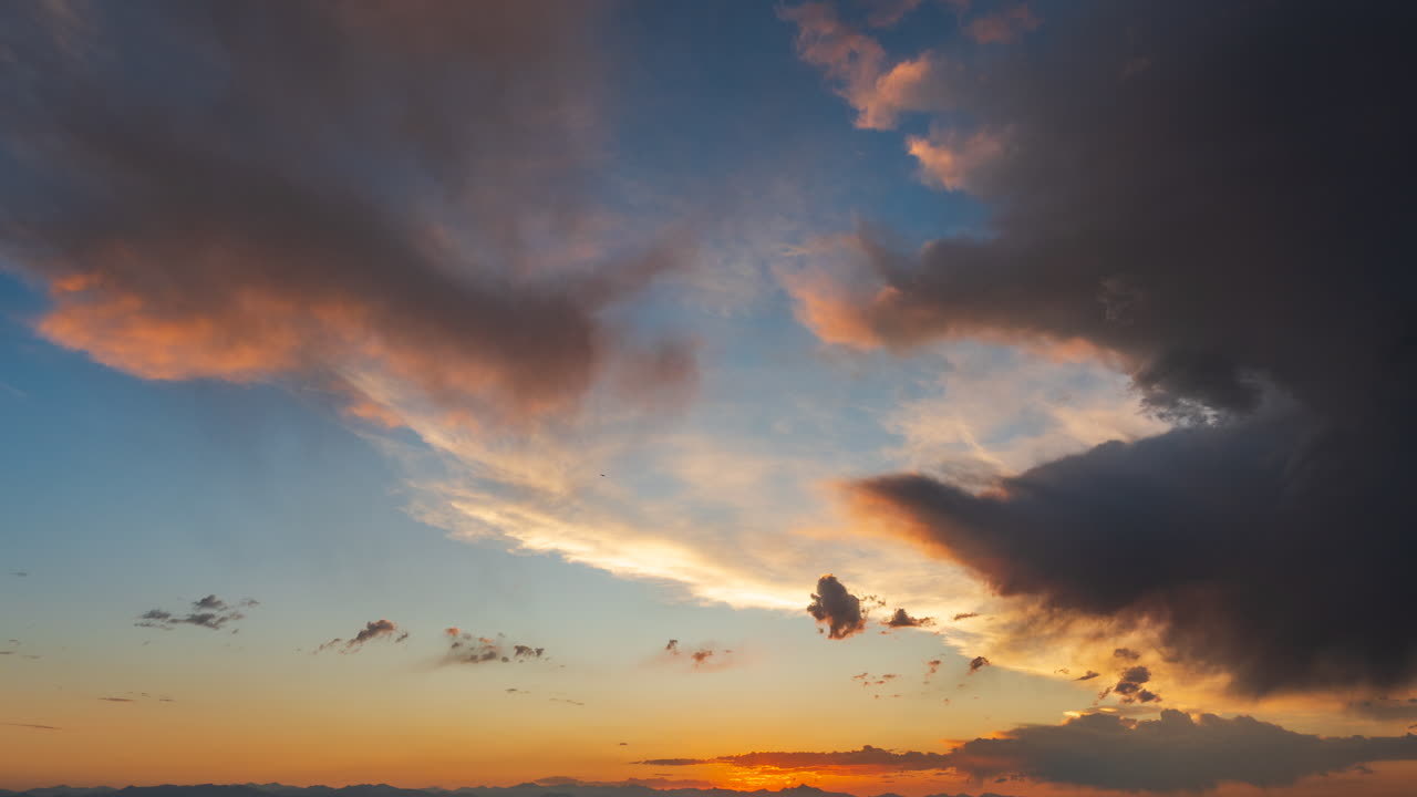 Sunset colors fill beautiful sky cloud movement of contrast and texture