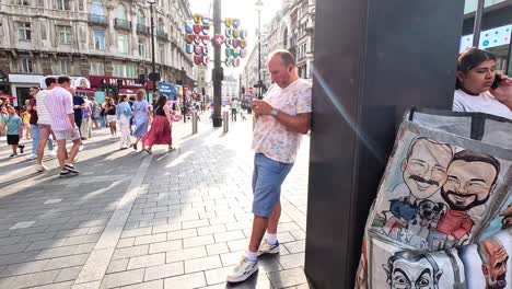 artist sketches portraits in bustling london square