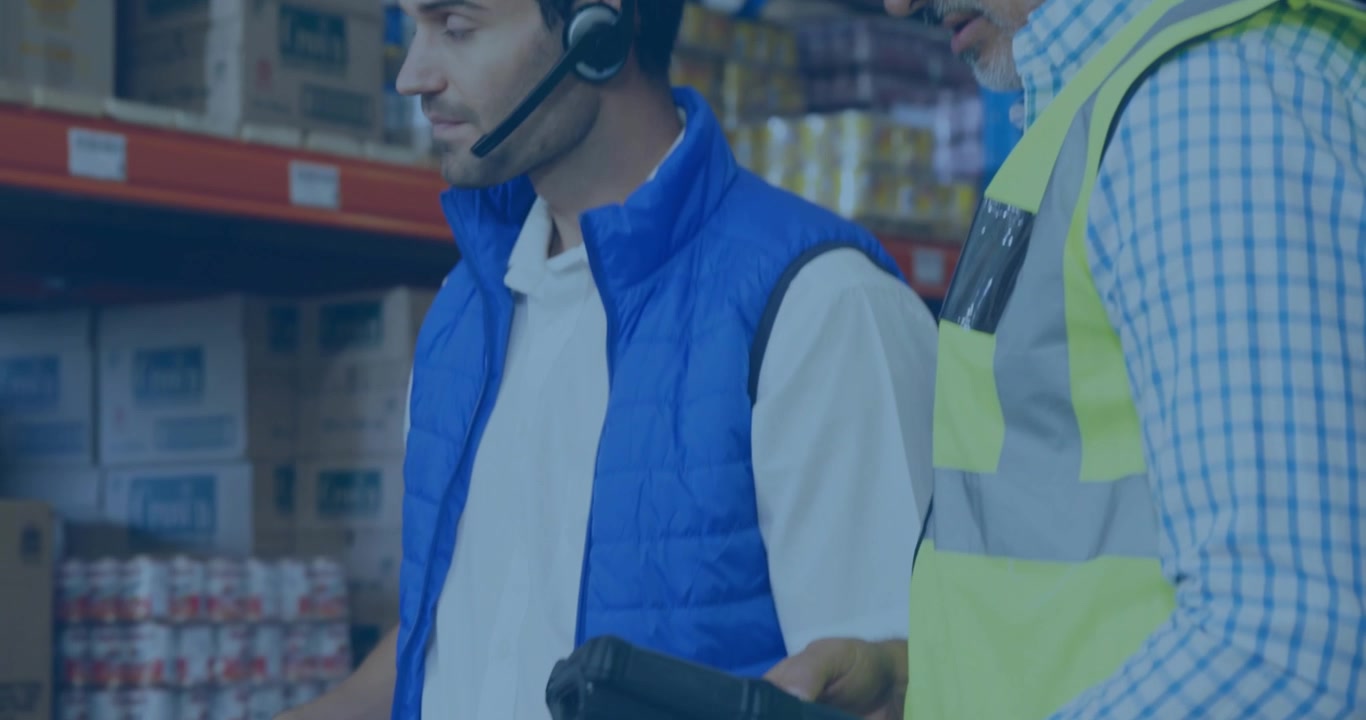 Warehouse coworkers reviewing inventory on laptop screen scanning barcodes and spawning popups