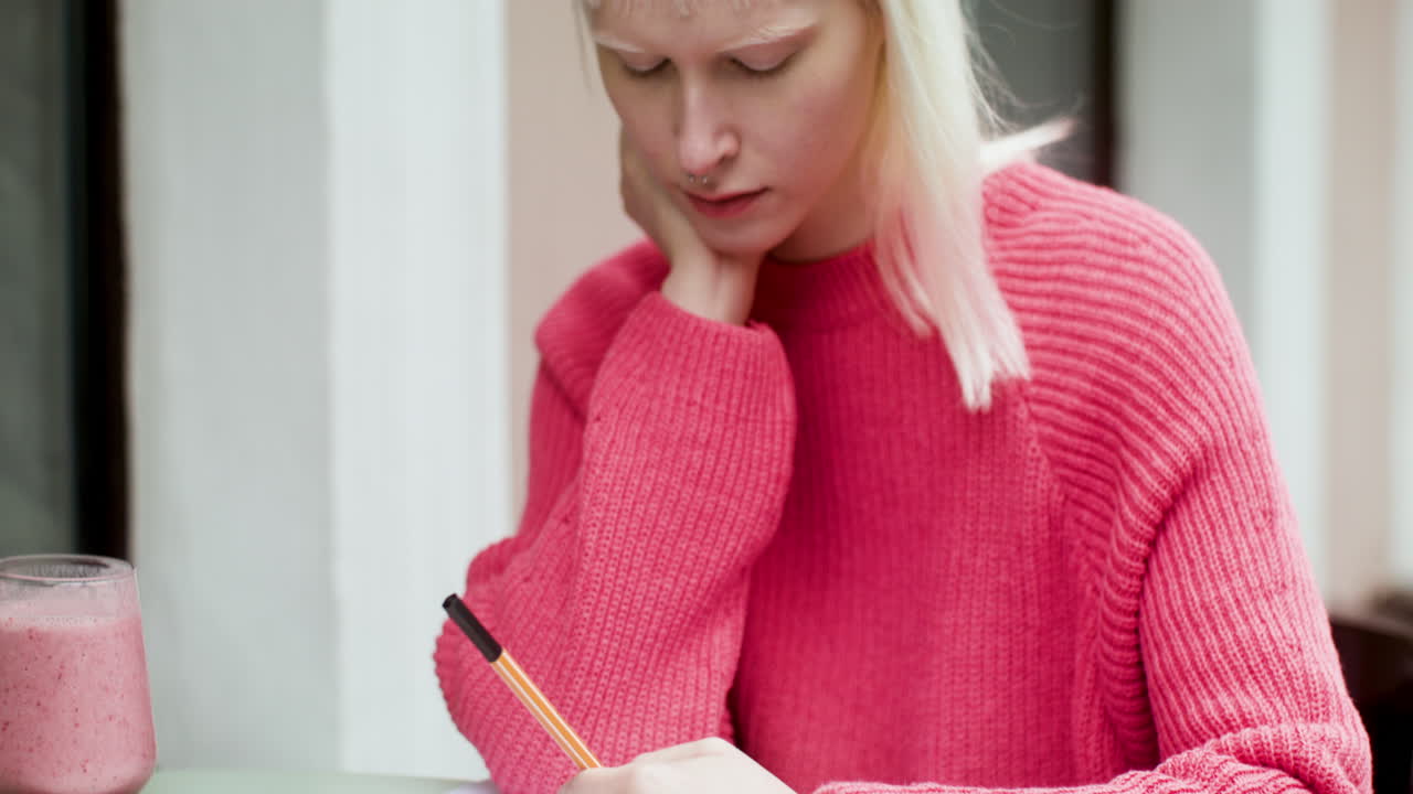 Thoughful woman on a terrace